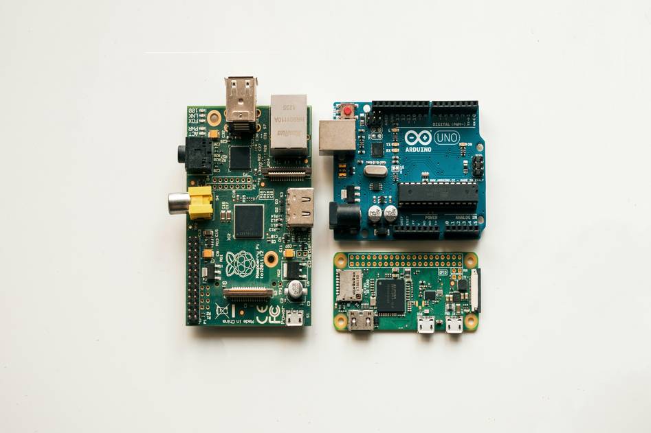 Arduino board with breadboard and jumper wires on a workspace