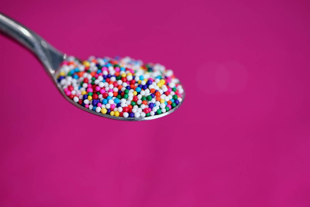 finished tamarind spoon candy recipe on stainless steel spoon