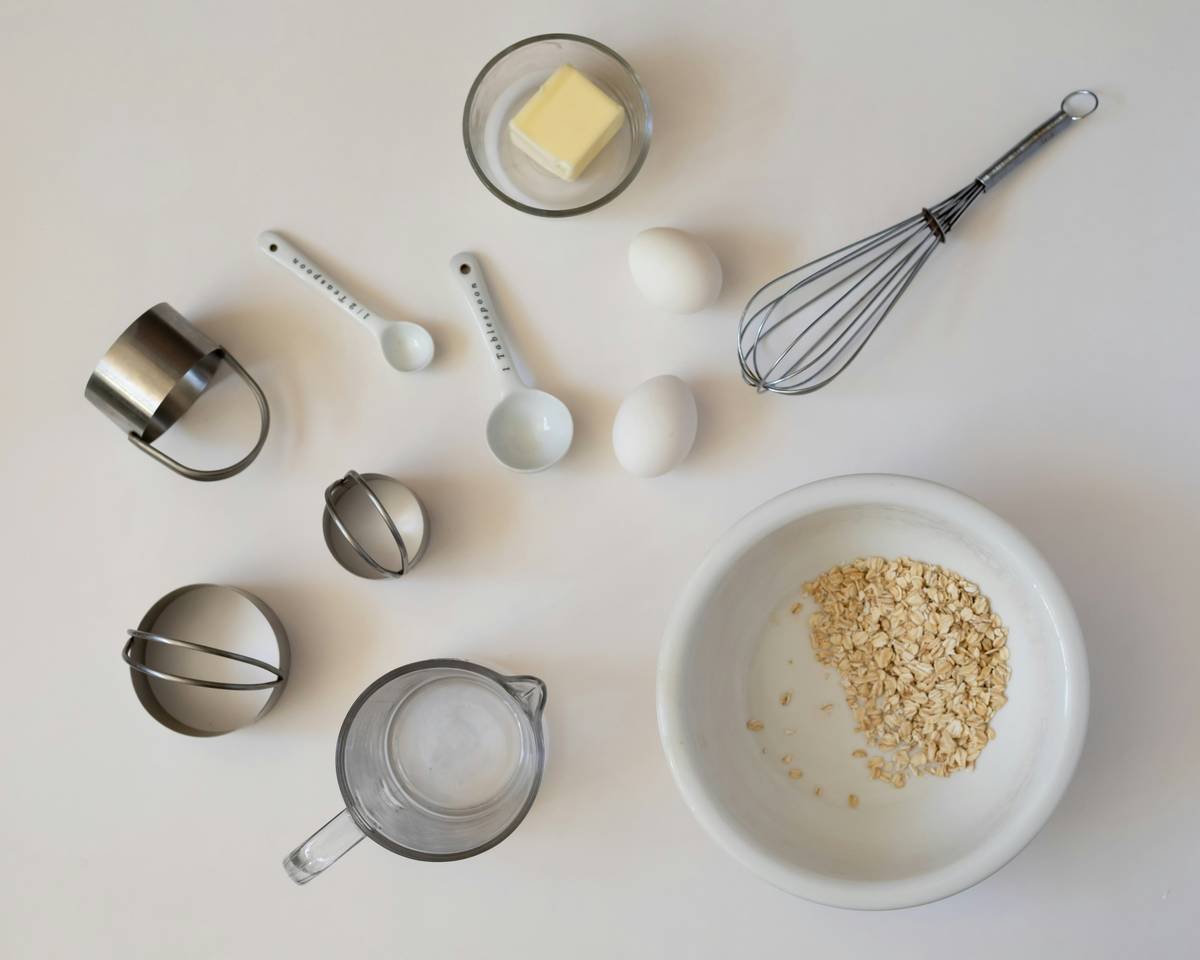 things you need to make candy including a digital candy thermometer, heavy saucepan, and heat-resistant spatula on a clean countertop